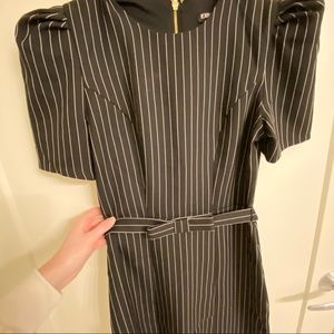 Black em with white striped dress.